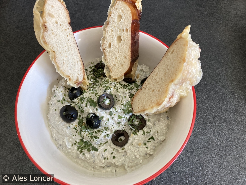 Tangy feta, savory olives, and plenty of fresh herbs. This creamy Mediterranean spread is proof that the simplest ingredients make the best comfort food. Just grab a slice of bread and dig in.