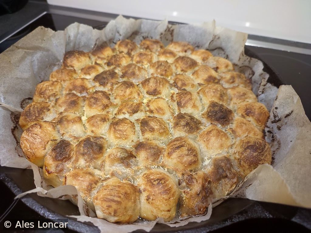 Homemade mantije straight from the oven. Crispy tops, soft layers, and all the flavors.