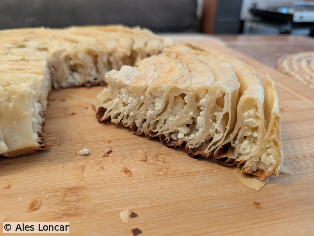 The money shot. Look at those defined, airy layers holding the pockets of melted white cheese. Absolute comfort food.