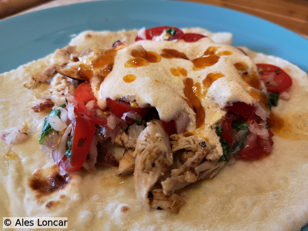 No cutting corners here. Homemade sourdough tortillas loaded with grilled chicken thighs, fresh cherry tomato salsa with a splash of orange juice, and chili sour cream. Finished with a drizzle of the hot pan juices because flavor belongs to the soul.