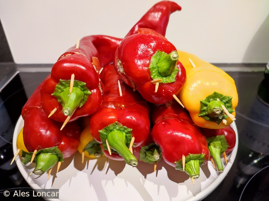 Stuffed, spiked, and ready to roar. These pointed peppers are held together by sheer willpower and a dozen toothpicks.